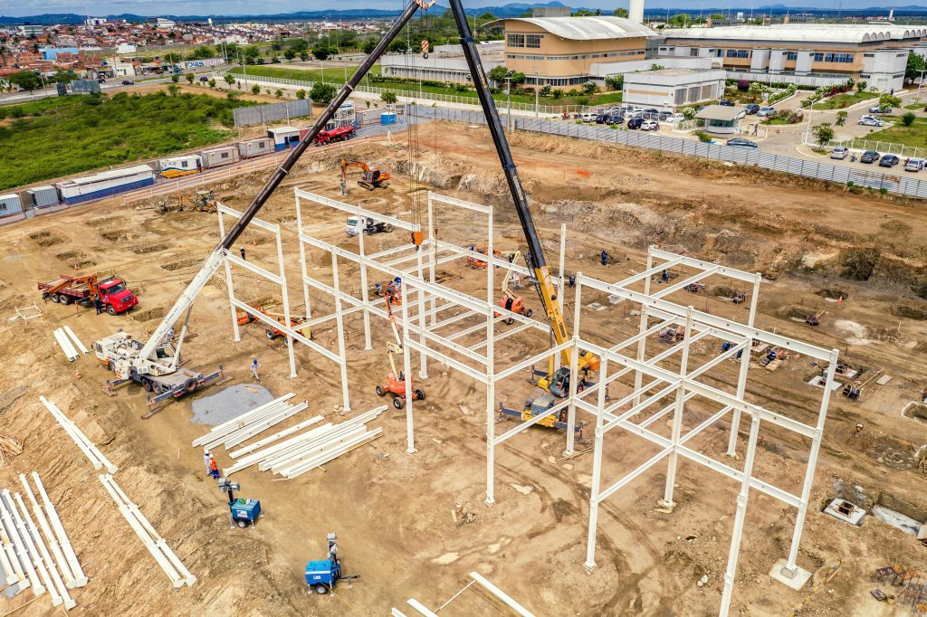 Aerial shot of an active construction site with cranes and machinery in Malvinas, Brazil.