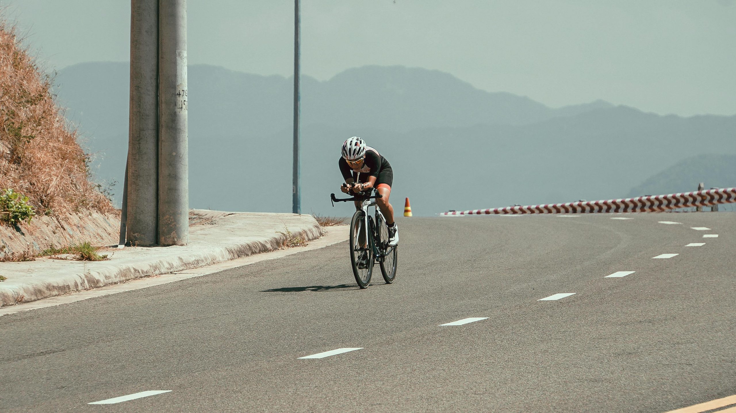 Cyclist on a mountain road in Nha Trang, Vietnam. Perfect for sports and travel imagery.